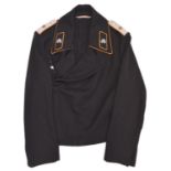 A scarce Third Reich black Panzer jacket, with yellow ochre piping to the collar, collar patches,