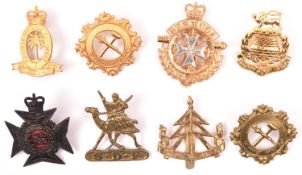 8 Colonial cap badges: Sudan Defence Force with screw fixing, Bermuda Defence Force post 1965,