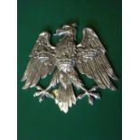 A polished cast aluminium heraldic spread eagle, with 3 crowns on its breast and wings, as used by