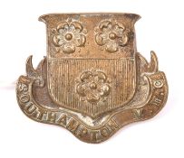A scarce WWI brass cap badge of Southampton V.T.C, shield over title scroll type. GC (minor wear)