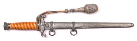 A Third Reich Army Officer’s dagger, with unmarked blade, orange grip and grey metal hilt, in its
