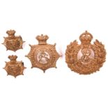 Victorian Army Service Corps cap badge and pair of collar badges; and ERVII Royal Engineers cap