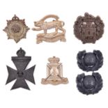 5 WWII plastic cap badges: Leicestershire (slightly bent), Essex, Wiltshire, KRRC and RASC, and