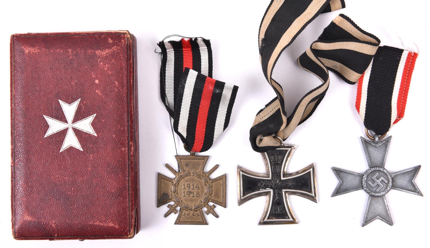 A 1914 Iron Cross 2nd Class; 1914-18 Honour Cross with swords; and grey metal 1939 War Merit Cross