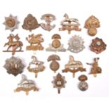 18 Infantry OR’s cap badges, mostly WWII pattern but including pre 1935 Northumberland Fusiliers,