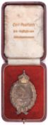 A WWI Imperial German Air Force breast badge, in its case, lid marked “Carl Poellath K B