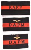 3 RAF Police black and red felt brassards, R.A.F.A., D.A.P.M. with metal eagle above, and D.A.P.M.