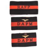 3 RAF Police black and red felt brassards, R.A.F.A., D.A.P.M. with metal eagle above, and D.A.P.M.