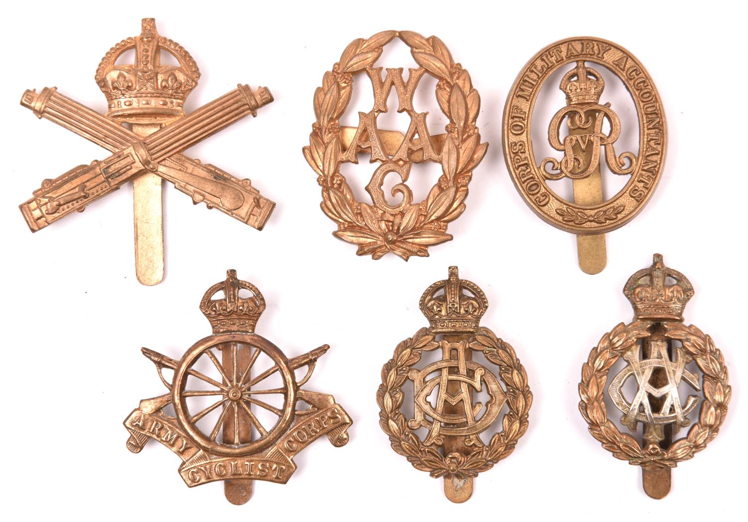 6 WWI and later Corps cap badges: Machine Gun Corps, 11 spoke Cyclist Corps, WAAC with blades, bi-