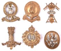 6 Cavalry cap badges: 11th Hussars, 12th Lancers, 13th Hussars, pre 1915 14th Hussars, post 1915