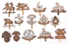14 Infantry cap badges: Queens (pre and post 1920), Buffs, King’s Own, pre 1935 Northumberland