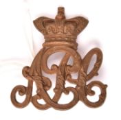 A scarce Victorian OR’s cap badge of the Army Pay Corps, 1900-1901, still bearing original GM