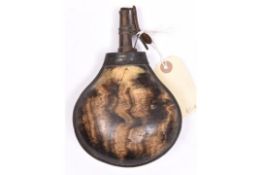 A mid 18th century brass mounted bulbous cow horn powder flask, 7" overall, the top with foliate