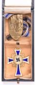 A Third Reich Mothers Cross, in its case, together with a “N S Volks Wohlfahrt” badge. GC £30-50