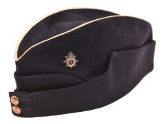 A Geo V Officer’s white piped blue field cap of the Army Service Corps, silvered and blue and white