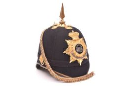 A Vic Officer’s blue cloth spiked helmet of The Dorsetshire Regt, gilt top mount and spike, peak
