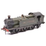 An O gauge coarse scale GWR 56xx 0-6-2T locomotive for 3-rail running. A kit-built white metal and