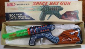 A Japanese plastic & tinplate Double Barrel Space Ray Gun' by 'KO of Japan'. Length 39cm. A tinplate