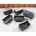 6x O gauge coarse scale freight wagons. 2x Tri-ang plastic wagons; a box van and an open wagon. A