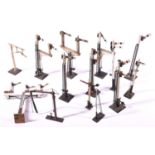 8x O Gauge model railway semaphore signals by Bassett Lowke; 3x single arm Home signals, 2x double