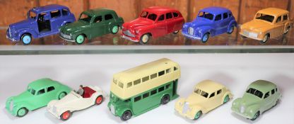 10 well restored Dinky Toys. Austin Devon and Austin Taxi, both in dark blue. Austin Devon in