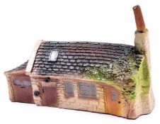 A Spot-On 'Cotswold Village' series building, 'The Smithy Village Forge'. Boxed, some age wear,