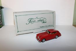 Four Wheel Models by S.M.T.S. (FWAM1) 1953 Aston Martin DB2/4 coupe. In red with mid brown interior,