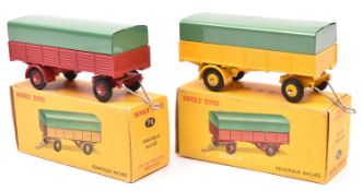 2 French Dinky Toys Remorque Bachee (2 axle covered trailers). One with a yellow body and ridged