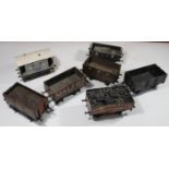 7x O gauge coarse scale kit-built freight wagons. An NER guard's van. 2x GWR open wagons. A GWR