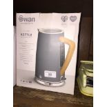 A boxed Swan kettle, unused.