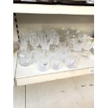 A collection of various cut glass drinking glasses