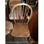 An Elm seated spindle back chair, an oak chair and green painted chair.