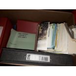 Box of empty files and travel leaflets