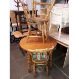 A round dining table and 4 country kitchen style chairs