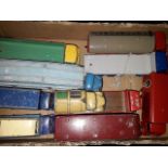 A box of playworn Dinky and other model vehicles.