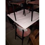 A formica drop leaf table and 4 chairs