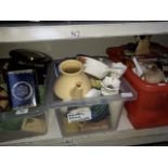 Three plastic crates of tins, glassware, pottery etc including Sylvac and Poole