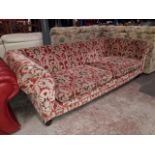 A large Tetrad Eigar Chesterfield style settee with scroll arms and fluted feet.