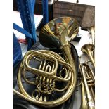 A Parrot brass French horn instrument with soft case