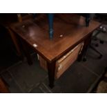 An oak drawer leaf table