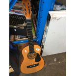 A childs acoustic guitar - no strings