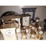 A collection of clocks including 9 miniature brass clocks