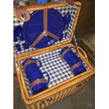 A wicker part picnic set.