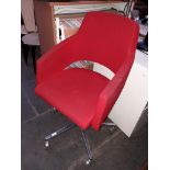 A Sitia Italian steel based red upholstered office swivel chair