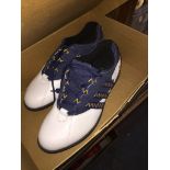 A pair of Adidas golf shoes, size 8.