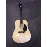 A Squier by Fender acoustic guitar