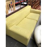 A mustard colour Ikea 3 seater sofa