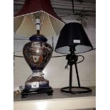 An eastern style pottery lamp and another lamp