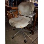 A vintage Herman Miller swivel office chair.