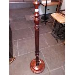 A standard lamp with reeded column